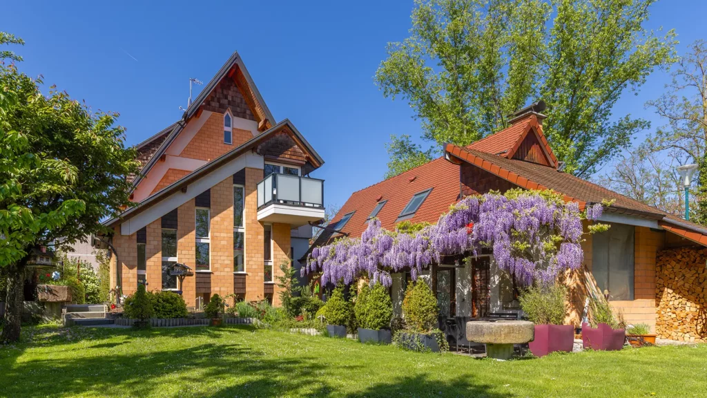Loft studio overlooking a leafy garden at Les Trois Cœurs, a peaceful retreat in central Saint-Louis near Basel.