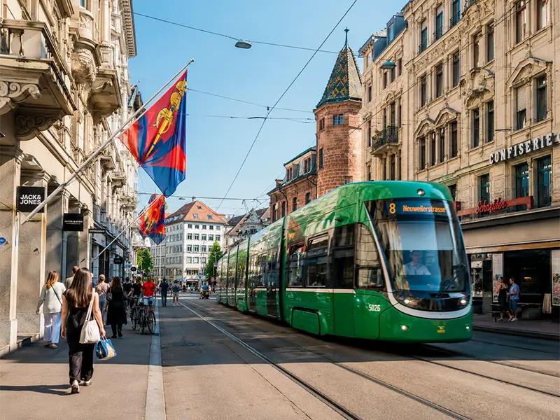 Basel tram line 8 on a sunny day in the city centre — getting around from Saint-Louis Alsace