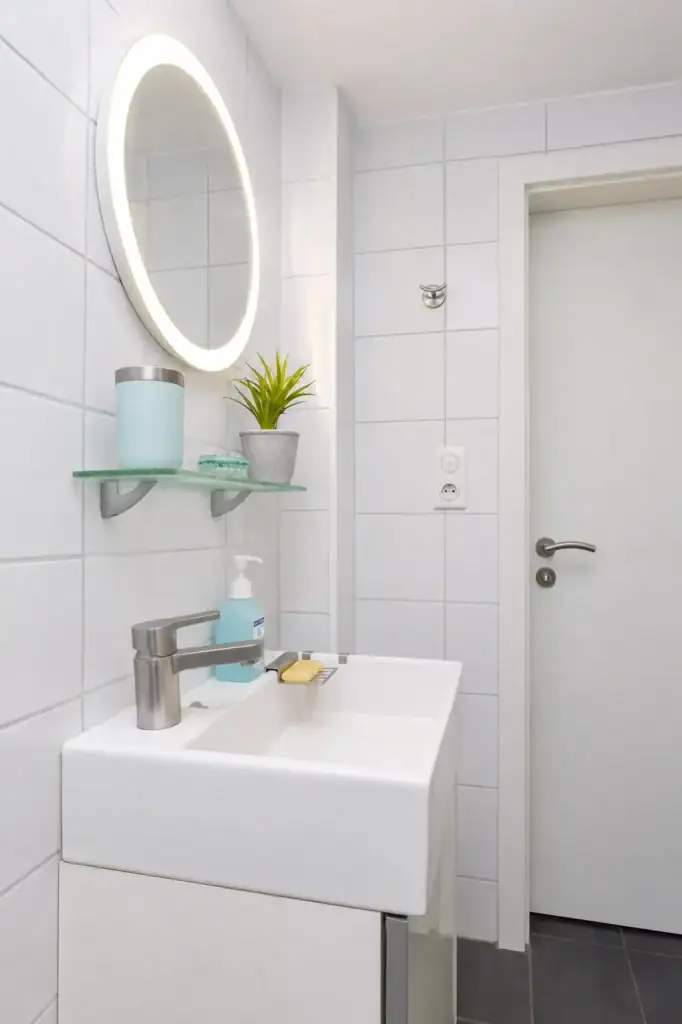 Illuminated bathroom mirror, short stay studio Saint-Louis France